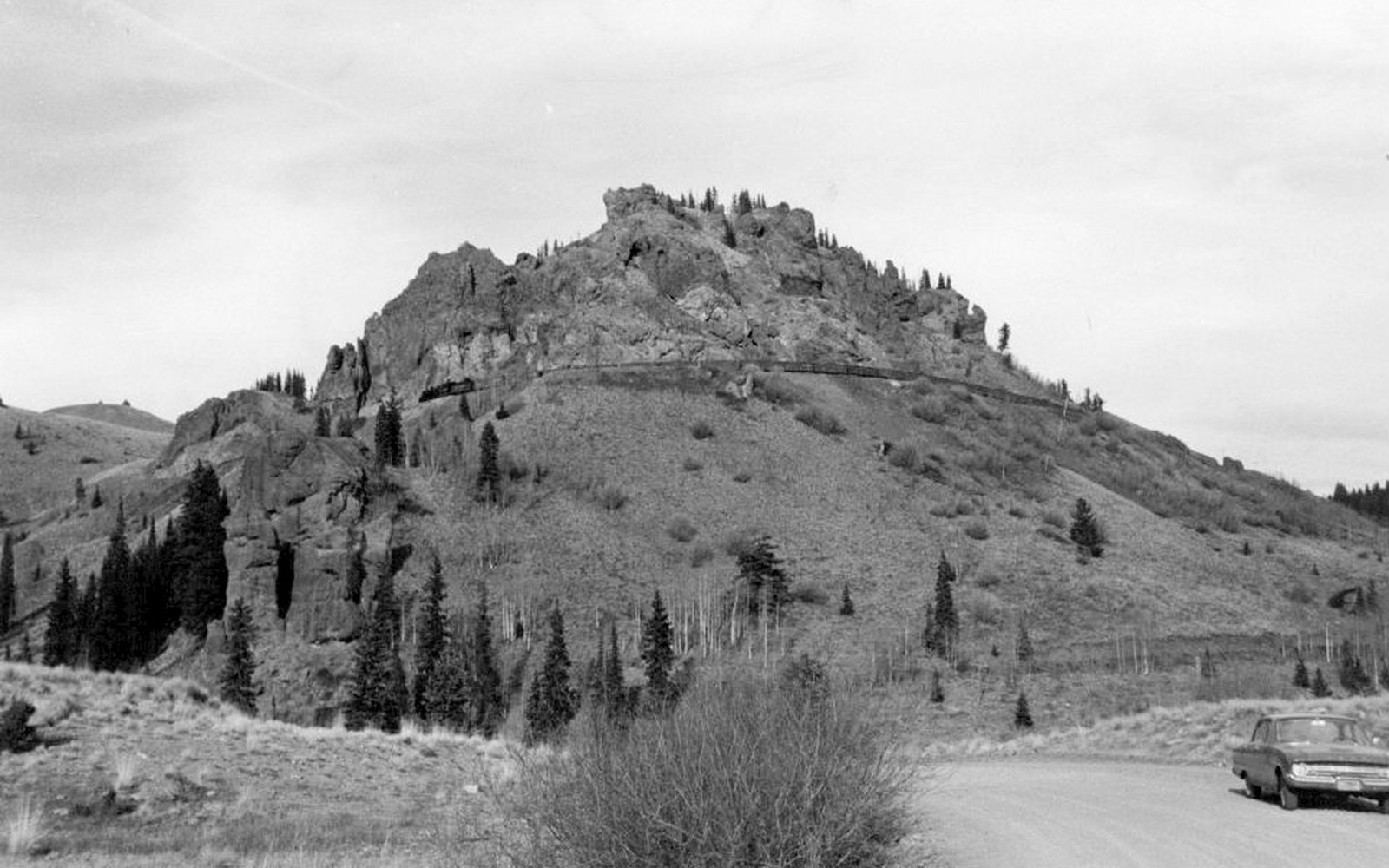 Narrow-gauge freight in the San Juans. Mears's toll roads reached the camps the territory would not fund.