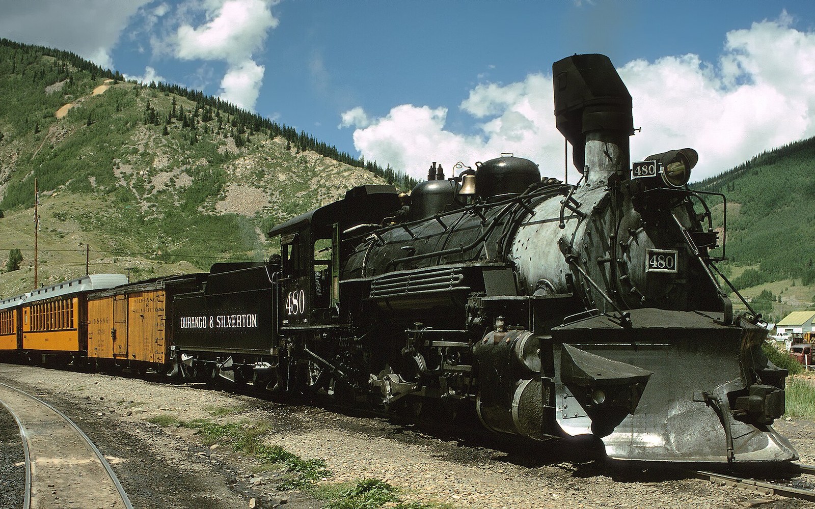 A K-36 in steam at the Durango depot, crew on the platform beside the cab. Ten of the class were built in 1925 and the roster has not changed since.