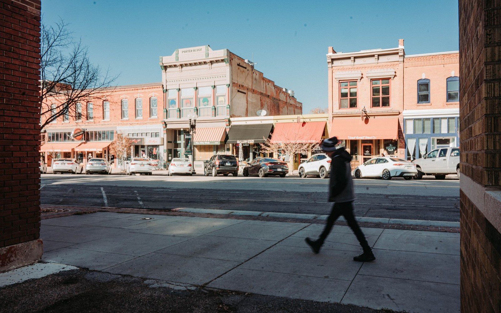Main Avenue at street level. The cast-iron and pressed-brick fronts date from the 1880s and 1890s.