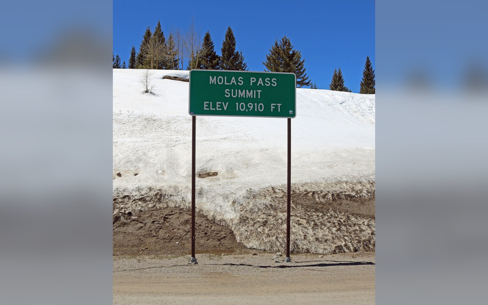 The summit sign on US 550. Molas Pass tops out at 10,910 feet, USGS.